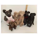 Stuffed bears, some with stands