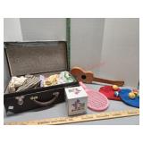 Suitcase with baby clothes, rackete, felt mits