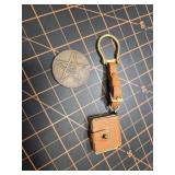 Leather mini book and old coin