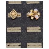 * Gold toned opal-like stone rings both size 6