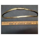 * Gold toned elastic belt