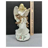 Sankyo porcelain angel music box figurine
