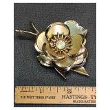 * Rhinestone gold tone metal flower brooch