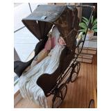 Baby buggy, early composition doll beautifully