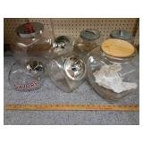 7 large  glass canisters w lids