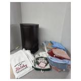 Step trash can and towels