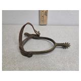 US A.B. marked brass spur, with leather straps