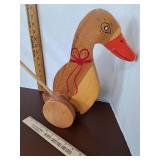 Vintage wooden hand painted duck push toy