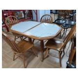 > table & 4 chairs 30" h x 53" w x 35 " d oak.