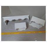 White scalloped wall shelves