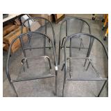 > Four metal mesh outdoor chairs