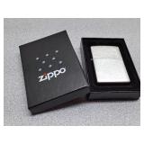 New Zippo lighter, never opened, brushed chrome