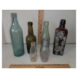 Glass bottles: Eagle,  Pluto water, Clicquot Club