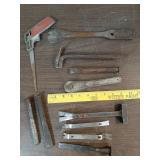 Saw, ratchet wrench, crate hammer and pry bar +