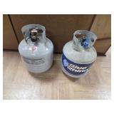 >2 propane tanks, 1 sealed, 1 with contents