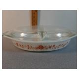 Pyrex divided 1 1/2 qt casserole.  Orange floral