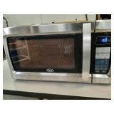 Oster microwave.  Works 21" x 11.5" x  18"d