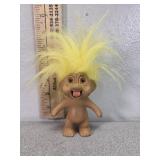 1991 troll doll, sticks tongue out yellow hair