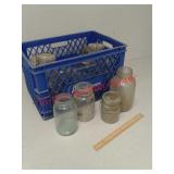 Glass canning jars and plastic milk crate
