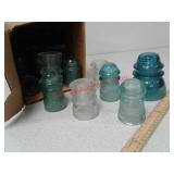 Several antique glass insulators