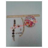 Jewelry assortment and water filled jeweled paper