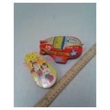 2 metal toys - noisemaker and test pilot airplane