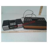 Vintage Atari video game system, iHome iPod radio