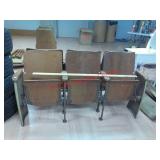 >row of 3 vintage theater seats made of cast iron