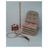 5 chair seat cushions, tennis racquets, baseball