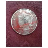 One troy ounce 999 fine silver round