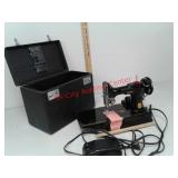 Singer featherweight sewing machine in storage