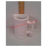 Unmarked white crock pitcher