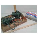 2 electrical extension cords and metal storage