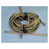 Electrical extension cord with lighted end -