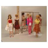 7 older Barbie / midge dolls with glass showcase