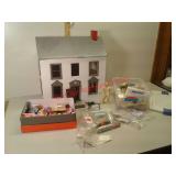 Cardboard dollhouse, craft supplies in tote and
