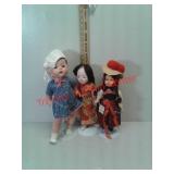 3 dolls with stands