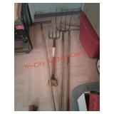 > lot of pitchforks and steel rakes