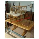 > Wood table and 4 dining room chairs