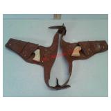 Two vintage cap guns in holster