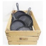 Grouping of Cast Iron Skillets in Wood Crate