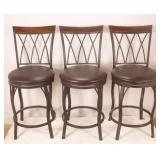 Three Swiveling Bar Stools
