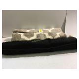 2 small rugs 1 black, 1 gray & cream