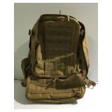 Hiking backpack appears used but