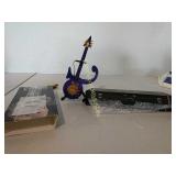 Purple symbol miniature guitar