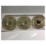 Three gold mirrors