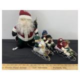 Santa and Snow People on Sleds