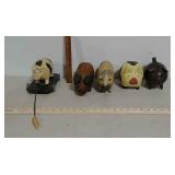 2 pig banks and 3 wooden pigs