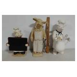 3 pig statuettes