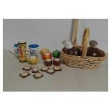 Candle holders, coffee mugs, basket w/ coconuts